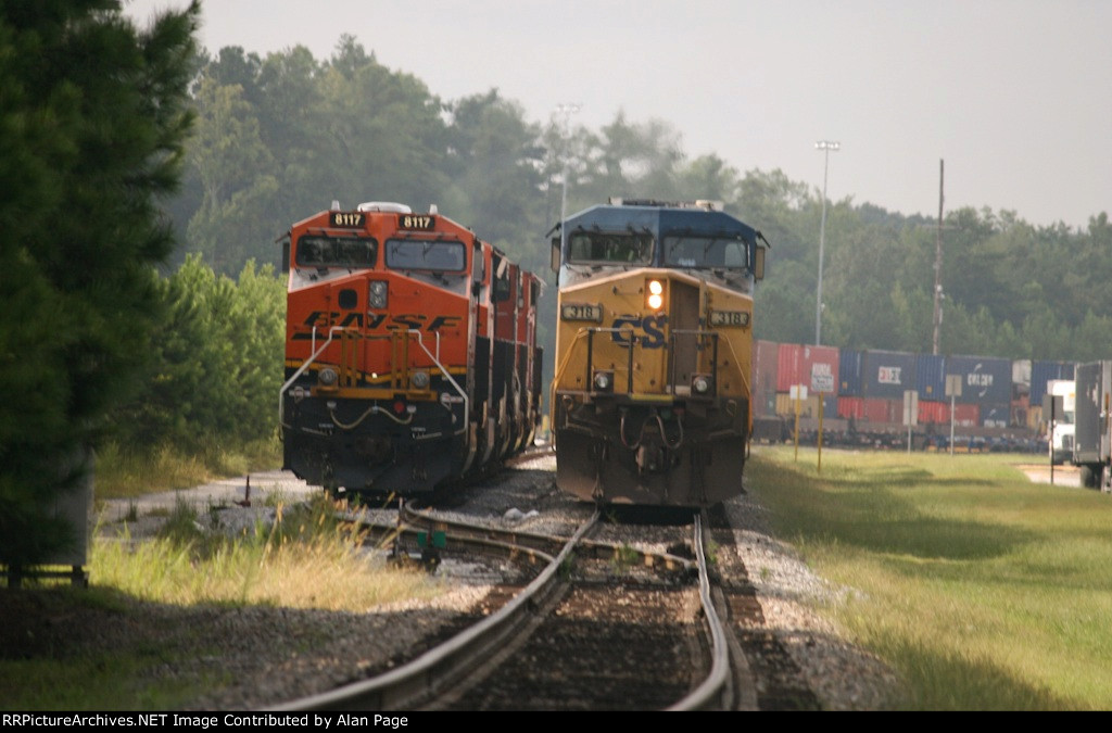 CSX 318 and BNSF 8117 are side by side